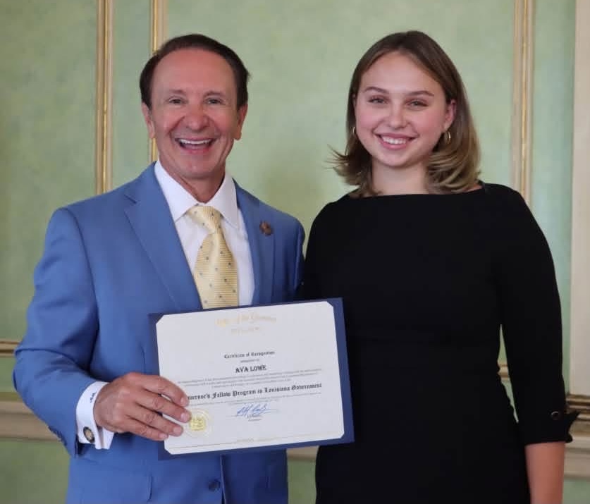 Gov. Jeff Landry gives certificate to Governor&rsquo;s Fellow Ava Lowe.