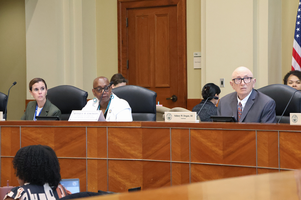 Board member listen to a presentation at the August 2026 Lease Sale.