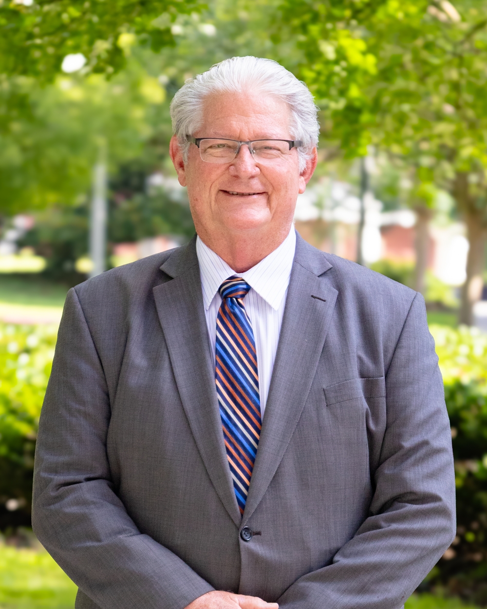 Mr. Mark E. Barton, in a personal headshot.