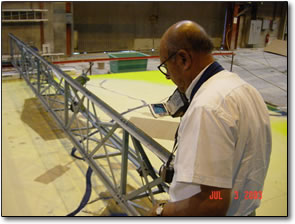 Sultan Alam observes the preliminary operation of the model in the construction phase.